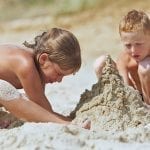 Sister-brother-building-Sand-Castle