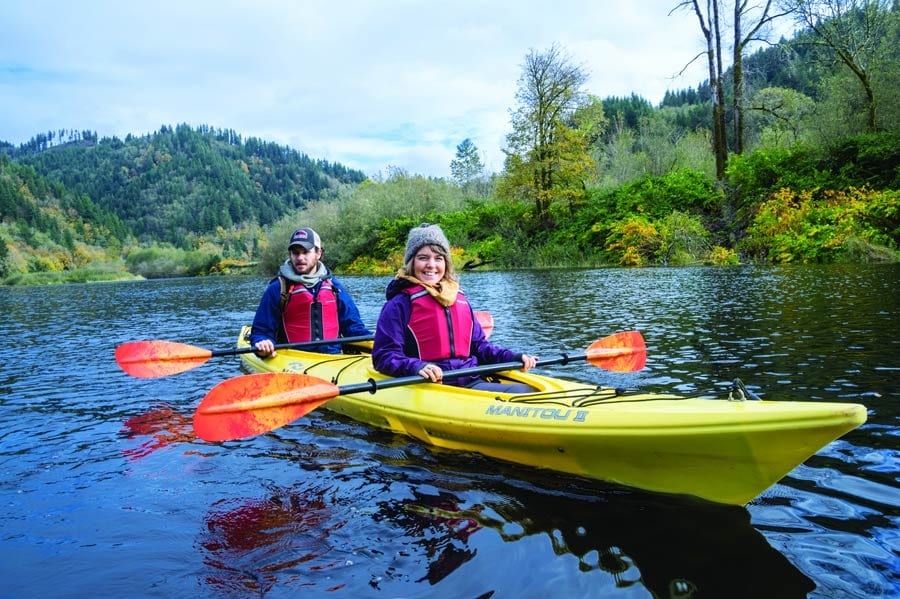 Couple kayaking, Rockaway Beach, Oregon