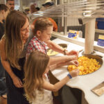 Visitors sampling cheese at the Tillamook Creamery.