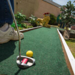 Playing mini golf.